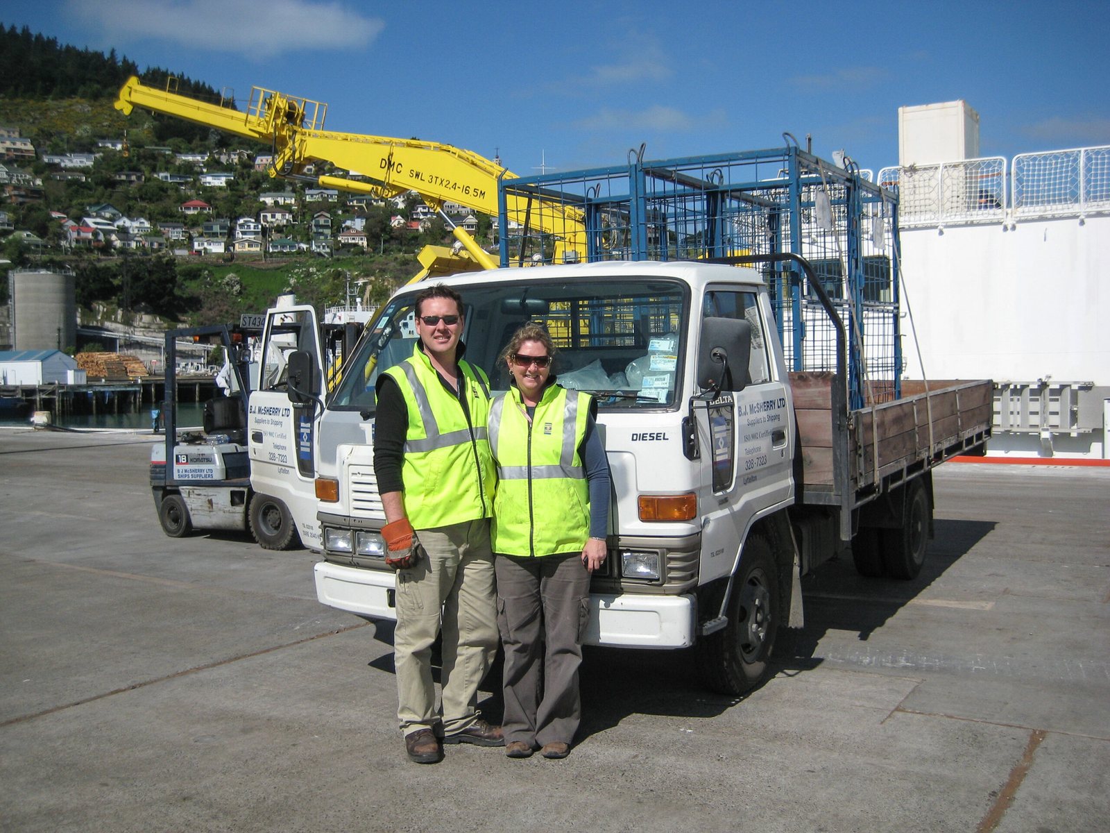 NZ Ship Supplies team members with a delivery vehicle at the port